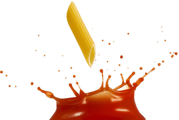 istock italian penne in splashing tomato sauce 1252421540