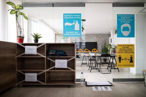 istock Empty classroom with information about covid-19 illness prevention and safety on classroom entrance 1252421717