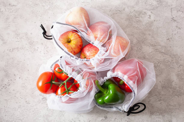 istock apples tomatoes bell peppers vegetables in reusable mesh nylon bag, plastic free zero waste concept 1252428008