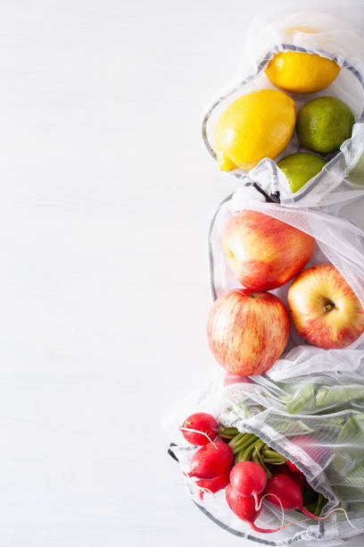 istock fruits and vegetables in reusable mesh nylon bag, plastic free zero waste concept 1252428084