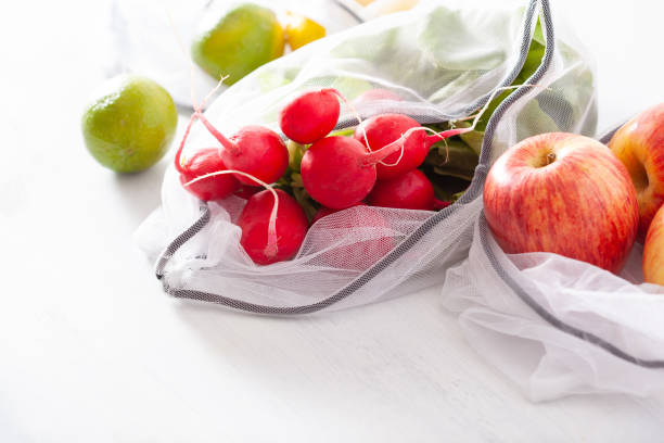 istock fruits and vegetables in reusable mesh nylon bag, plastic free zero waste concept 1252434580