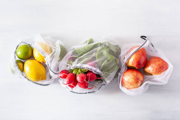 istock fruits and vegetables in reusable mesh nylon bag, plastic free zero waste concept 1252434599