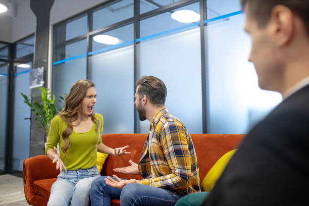istock Young man and woman yelling at each other angrily 1252436241