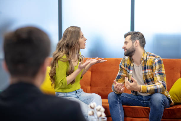 istock Young couple having an argument during the psychotherapeutic session 1252436244