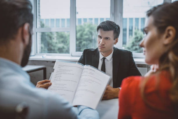 istock Boss strictly looking at his employees report 1252436791