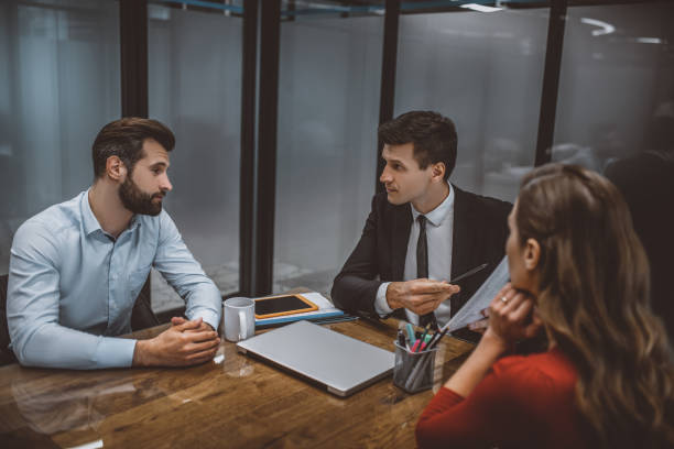 istock Lawyer talking about the marital contract with spouses 1252437386