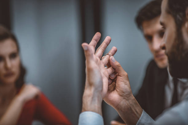 istock Man getting rid of his wedding ring 1252437996