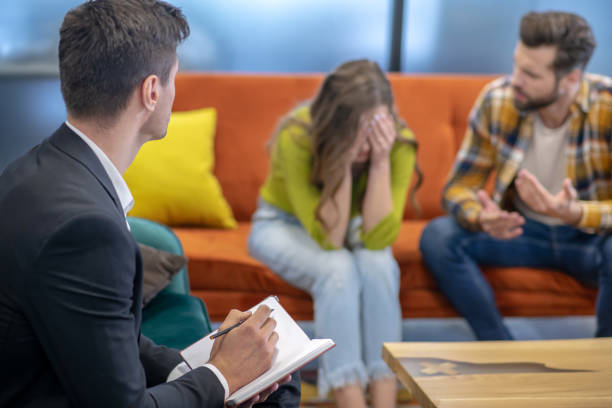 istock Professional psychotherapist helping a young couple to solve their problems 1252438034