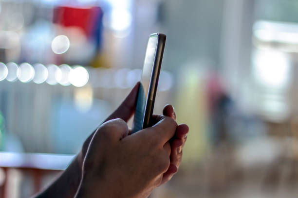 istock Woman's hands typing message on smart phone. 1252439278