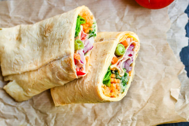 tortilla or burrito wrap stuffing vegetables vegetarian pita bread Menu concept serving size. food background top view copy space