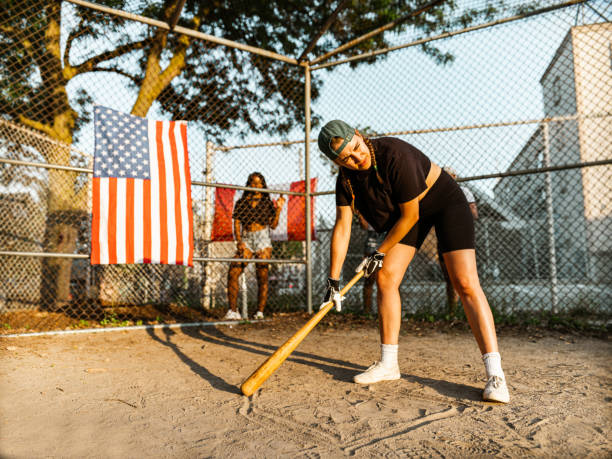 istock Diverse group of youung people playing softball 1252442779