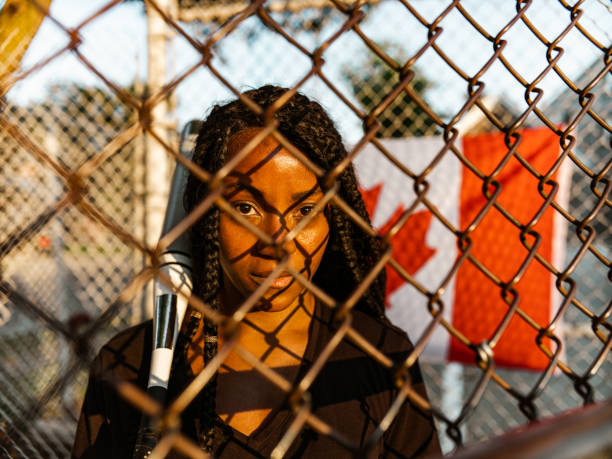 istock Young Black woman at the softball 1252442862