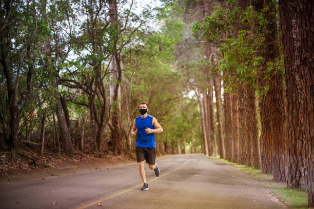 istock Exercising (Running) Outdoors With a Face Mask - Covid19 1252442941