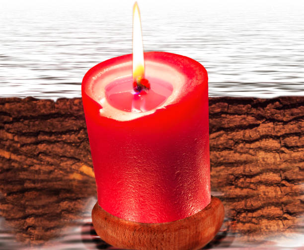 Photo of Composition from red candle and water