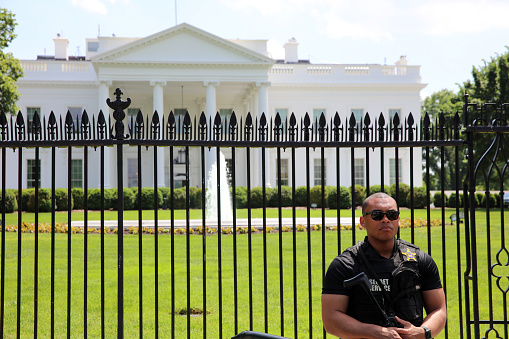 Washington DC, USA - May 02, 2019: U.S. Secret Service Officer in front of White House. Washington DC. USA