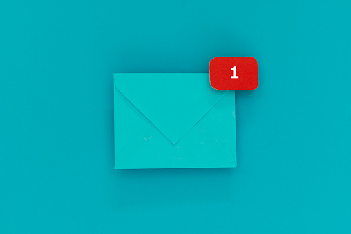 Blue envelope with notification sign with the number 1 on blue background