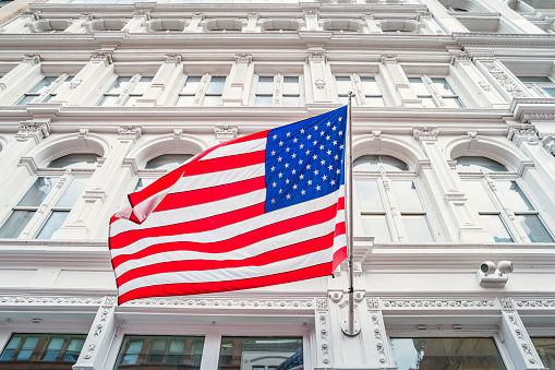 American flag and ornate facade in the Flatiron district of New York City USA