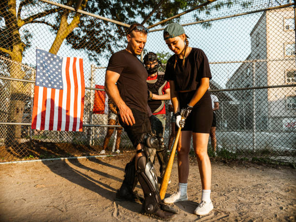 istock Diverse group of young people playing softball 1252460351