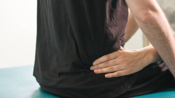 istock Physiotherapist with disabled person 1252460713