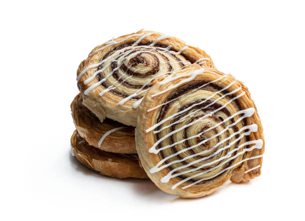 istock Freshly baked traditional cinnamon swirls isolated on white 1252462277