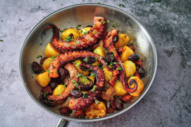 istock Octopus Tentacles with Potatoes and Fresh Lemon 1252463587