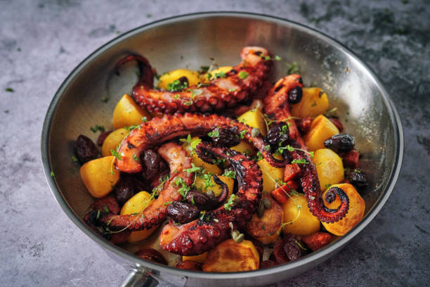 istock Octopus Tentacles with Potatoes and Fresh Lemon 1252463677
