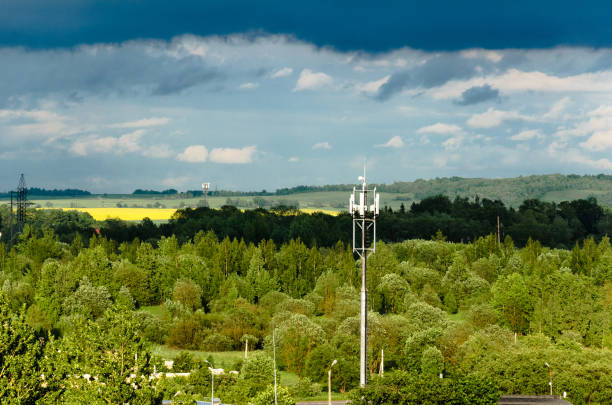istock Mobile tower rises above the neighborhood 1252468135
