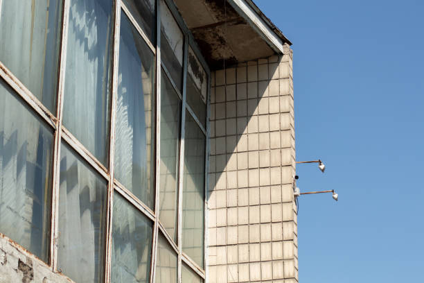 istock windows of office building and blue sky 1252471089