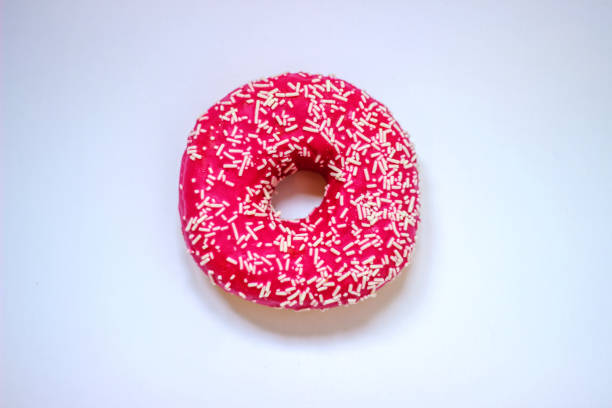 istock One big delicious donuts on the white background. 1252471097