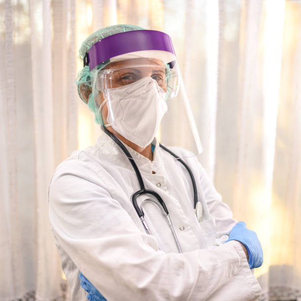 istock Female Medical Worker Wearing Protective Face Mask 1252471108