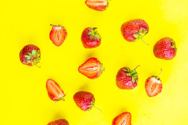 istock Fresh strawberry pattern on bright yellow background, top view, minimal concept 1252475056