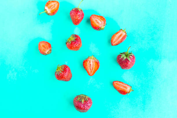 istock Fresh strawberry pattern on bright blue background, top view, minimal concept 1252475083