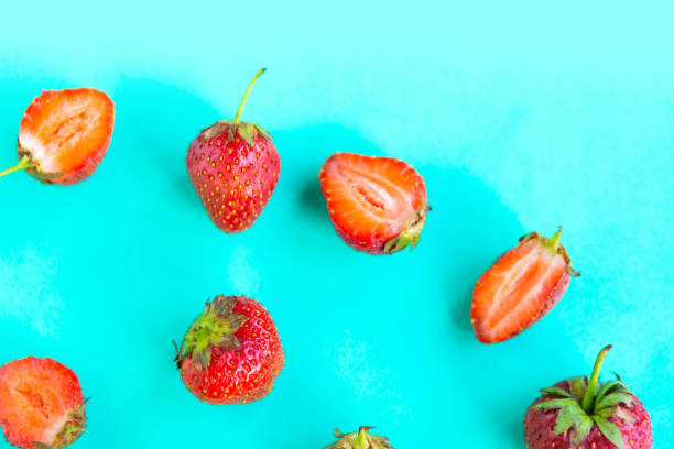 istock Fresh strawberry pattern on bright blue background, top view, minimal concept 1252475137