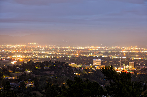 City of Los Angeles at dusk, aerial view, San Fernando Valley, Verdugo Mountains are seen in the background, California.