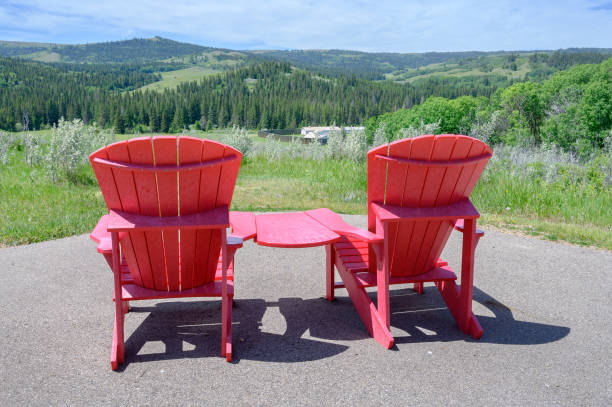 Home decor. Red deck chair on patio at sunset.
