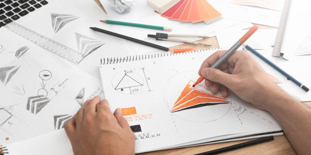 istock Graphic designer drawing sketches logo design. 1252482677
