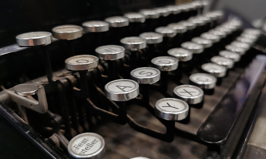 Close up of vintage typewriter keys with selective focus.