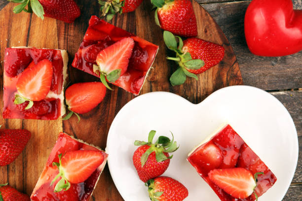 istock strawberry cake and many fresh strawberries on rustic table 1252484548