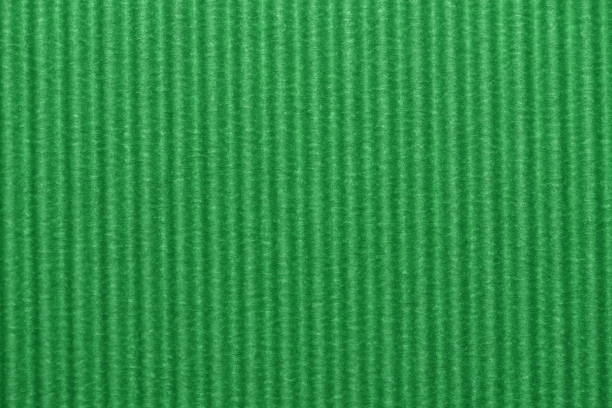 istock Light green colored corrugated cardboard texture useful as a background 1252488284