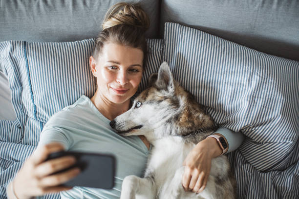 istock Relaxing in bed and take selfie 1252489555