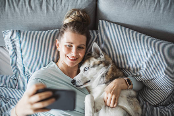 istock Relaxing in bed and take selfie 1252489570