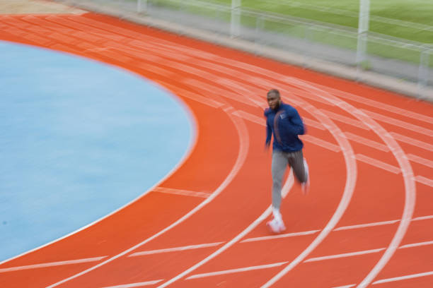 istock Young African American man running at tartan. 1252489764