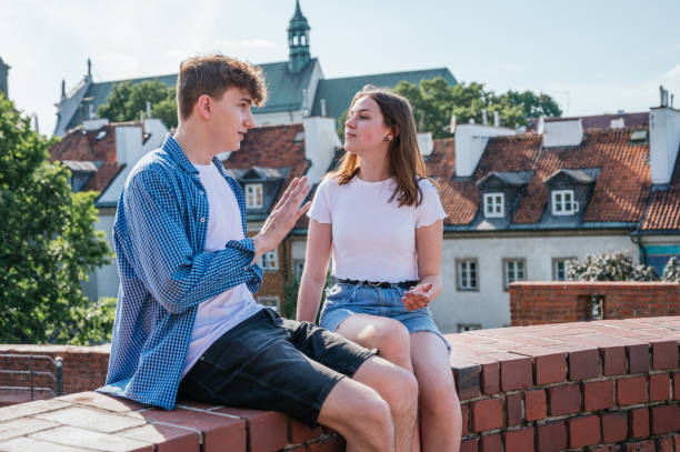 istock Young couple talking and having fun outdoors 1252491172