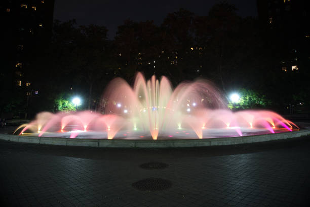 istock Red colored water fountain at night 1252491320