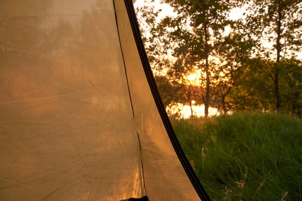 istock Part of a camping awning tent inside with river view. 1252493948