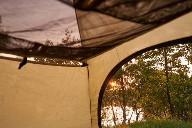 istock Part of a camping awning tent inside with river view. 1252493969