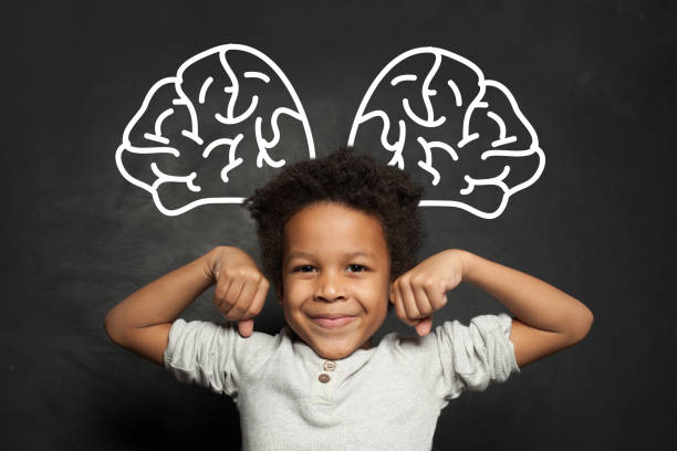 istock Clever kid student on blackboard background, brainstorming and brain power concept 1252494251