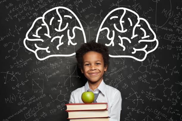 istock Happy smart kid student on blackboard background, brainstorming concept 1252494255