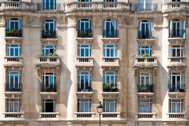 Parisian tenement facade Facade of the Parisian freestone building old building stock pictures, royalty-free photos & images