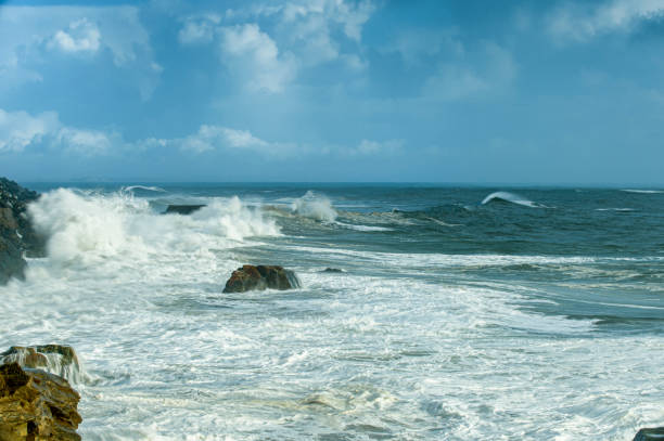 istock Ocean Waves Crashing on Coastal Rocks 1252499631